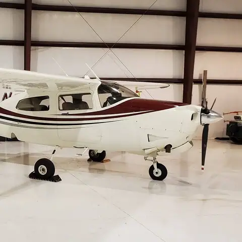 Single-engine airplane detailed in a hangar