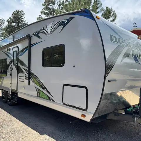 Travel trailer washed and detailed in a driveway